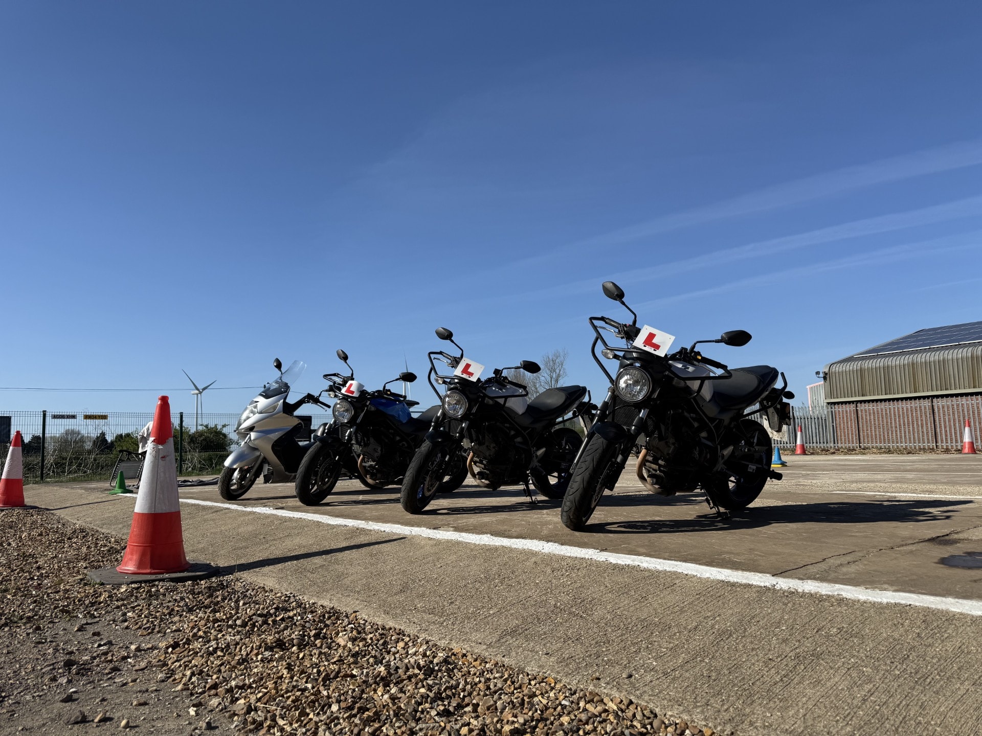Training motorcycles lined up on the pad