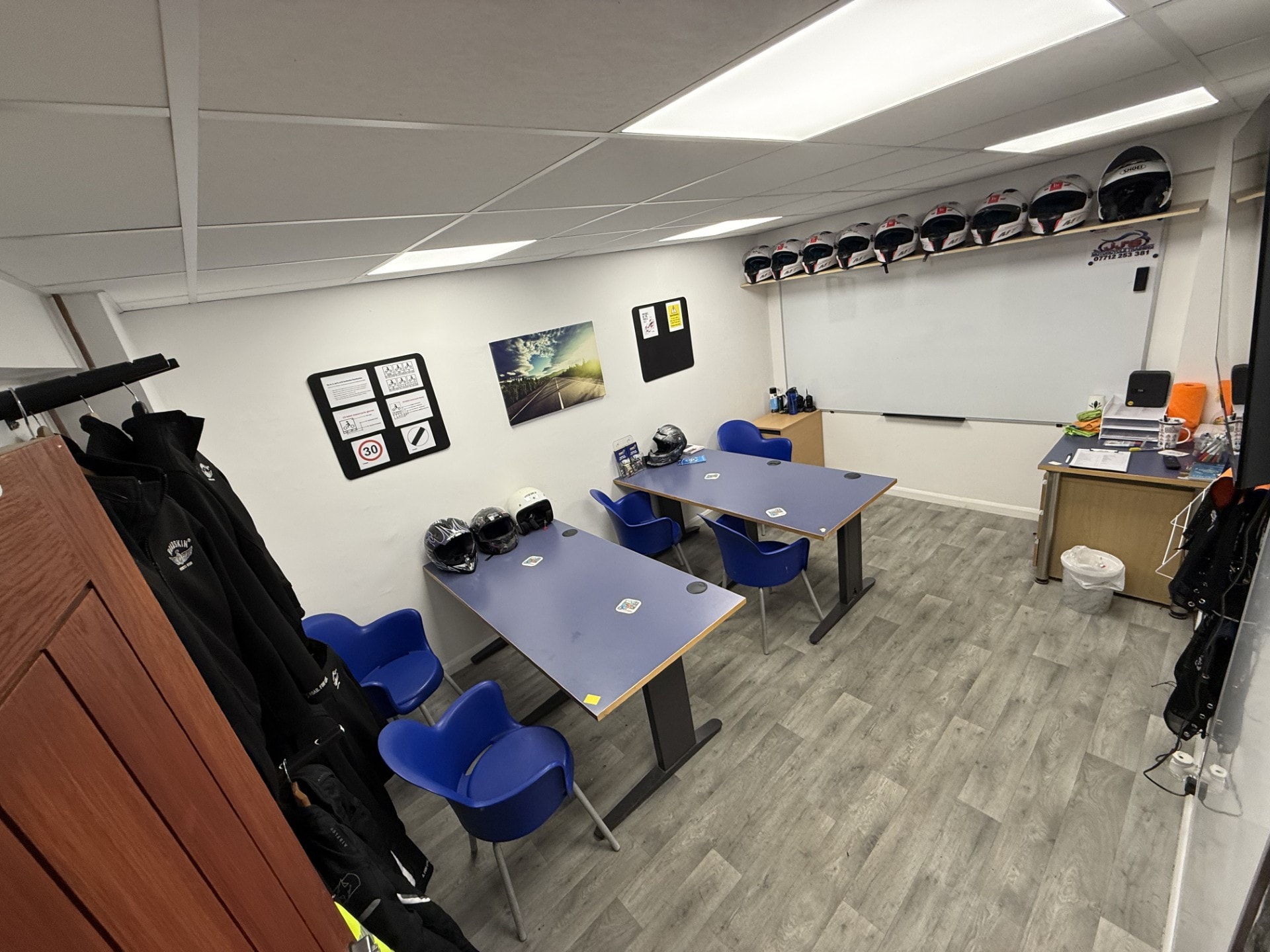 JJ's training classroom with helmets and blue chairs